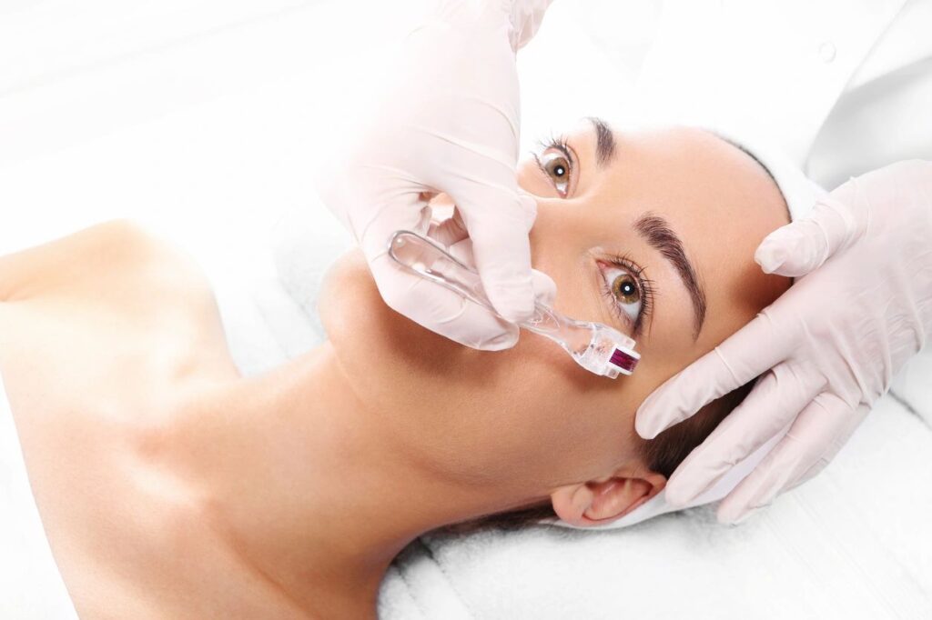 A woman getting her face waxed at the spa