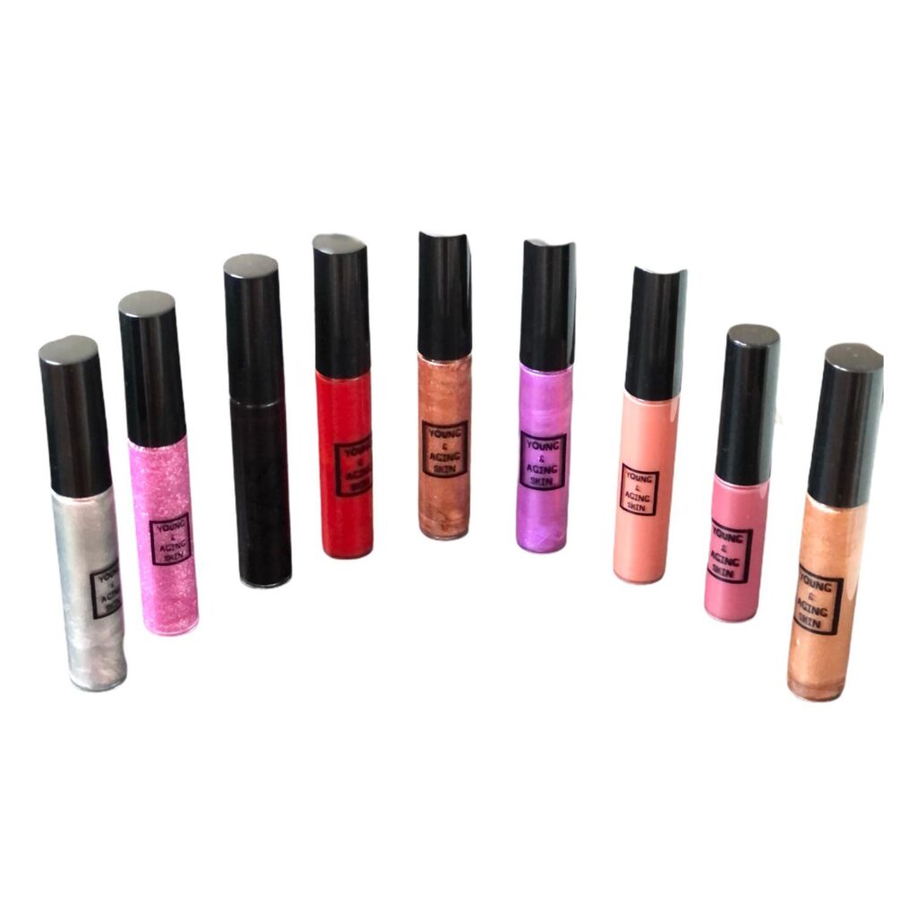 Various colorful lip gloss tubes arranged neatly.