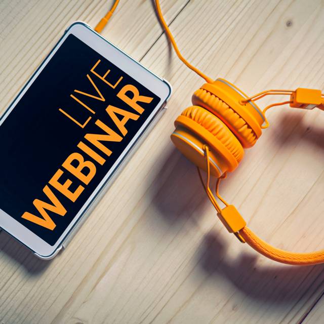 A phone and headphones with the words live webinar on it.