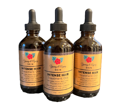 Three bottles of hair oil are shown.